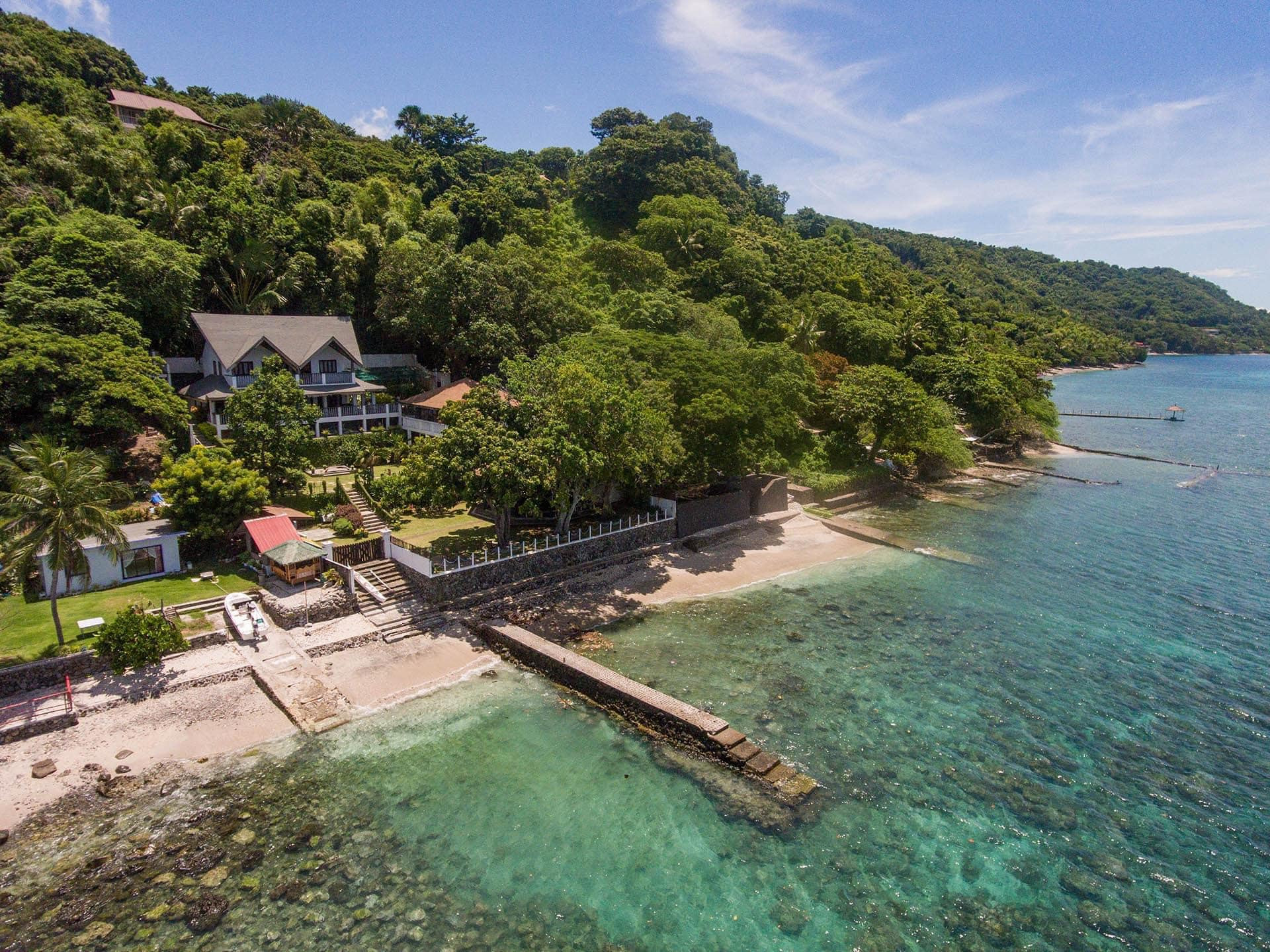 An Astounding White Beachfront Resthouse for Sale in Batangas photo 1