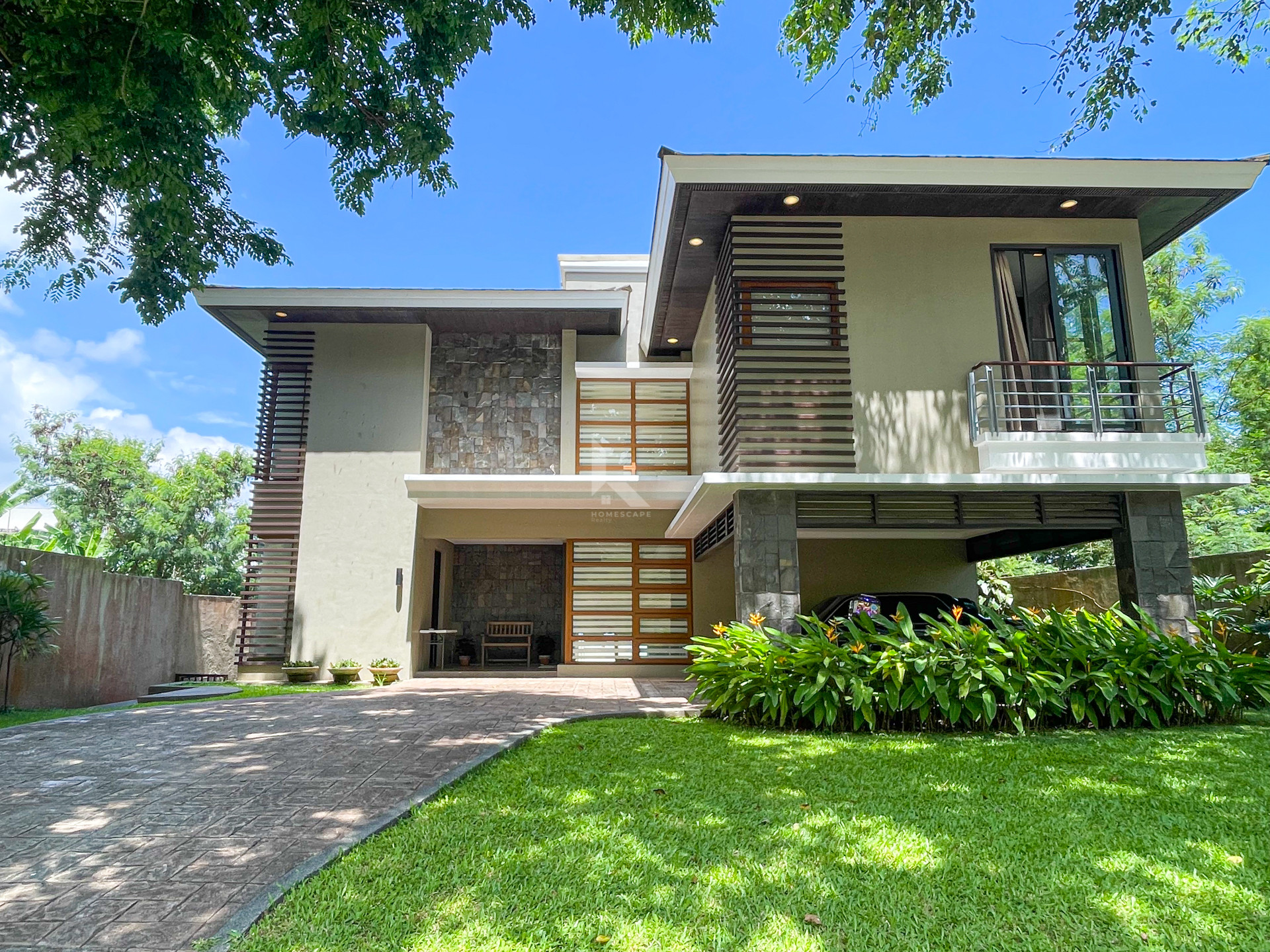 reathtaking Modern Tropical House and Lot For Sale in Ayala Greenfields photo 1
