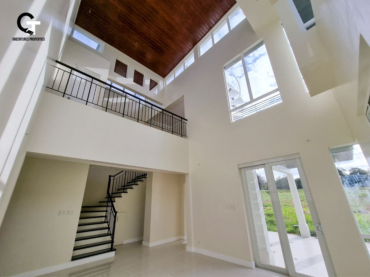 Modern High Ceiling American House and Lot Design with Mt. Makiling Balcony photo 4