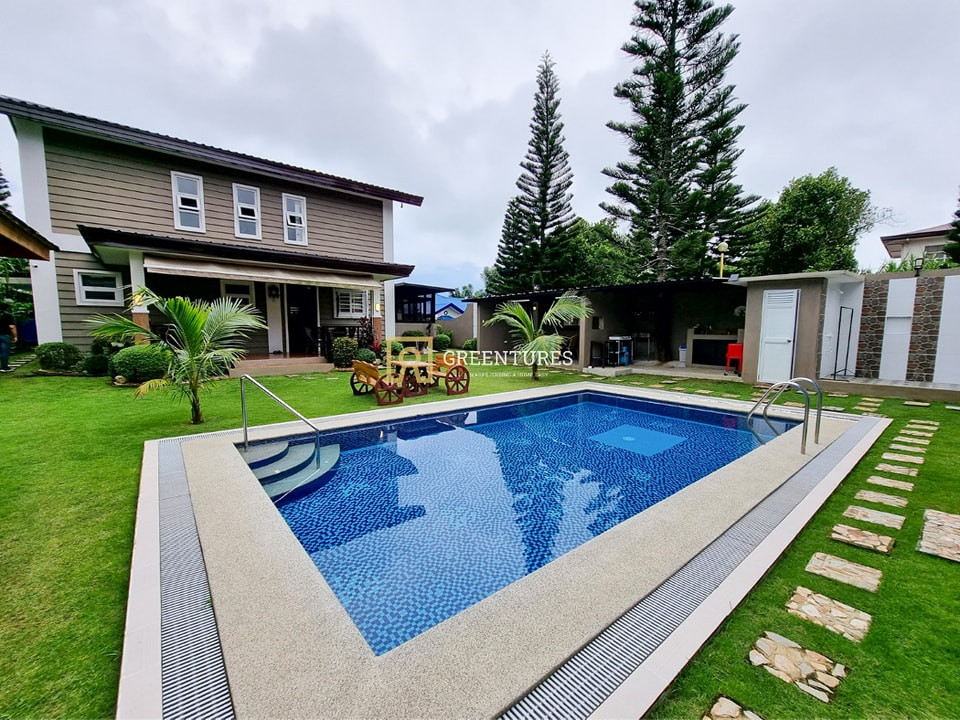 Modern Wooden Log Inspired Theme House and Lot with Swimming Pool photo 1